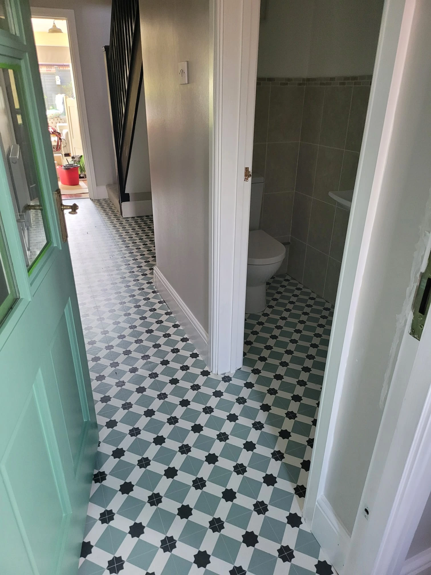 Waterproof cushioned vinyl flooring with stone effect finish in a kitchen environment